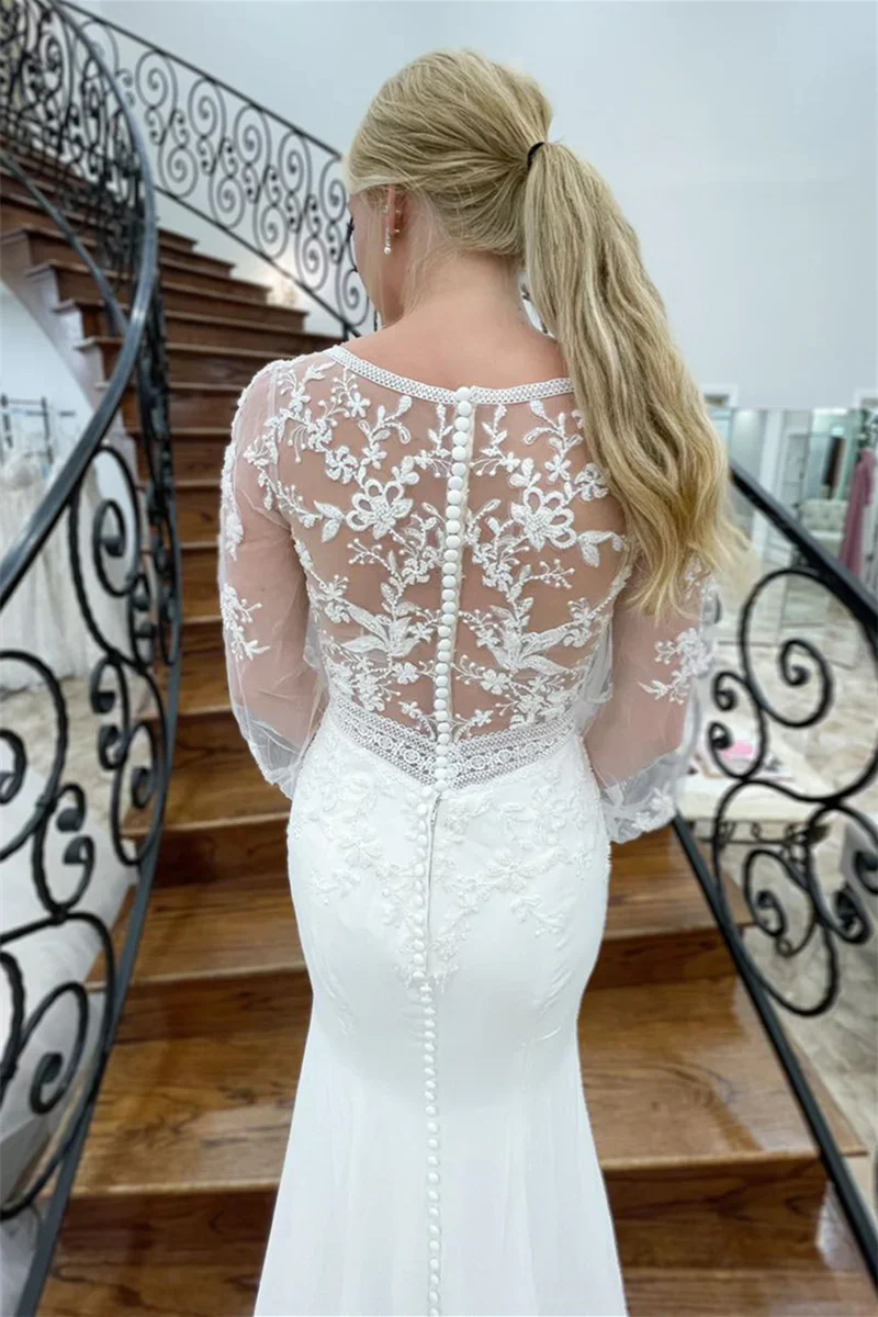 Vestido de novia largo de sirena con escote en V profundo y mangas ilusión con apliques